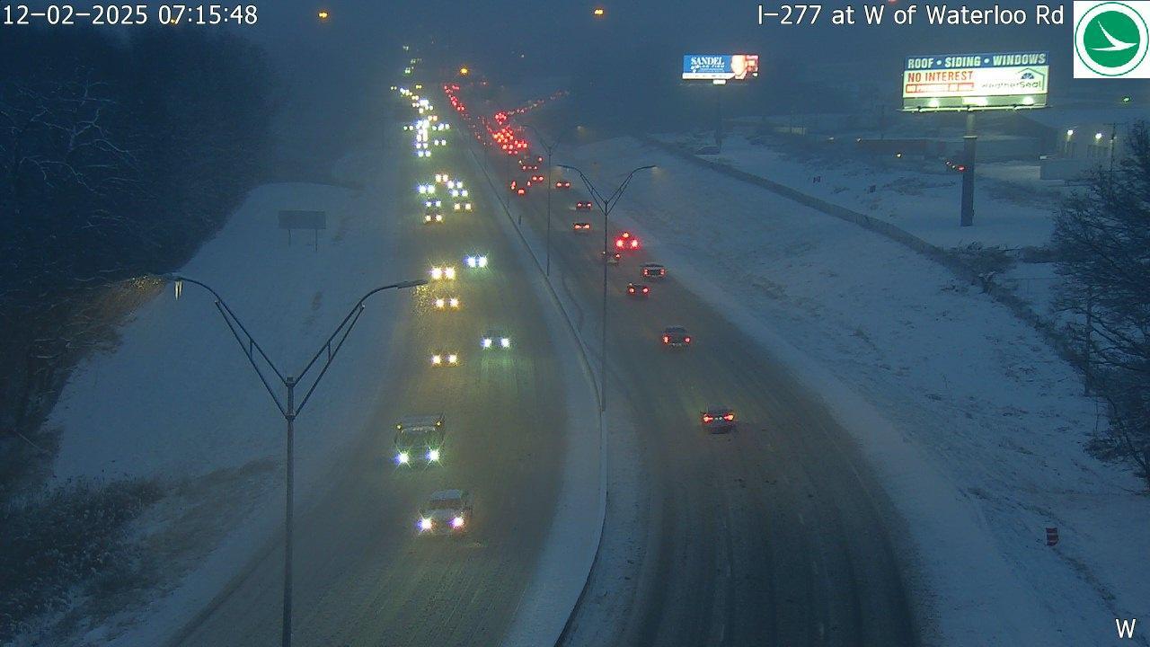 Typically shows a road or highway in Ohio with or without vehicles from a traffic camera.